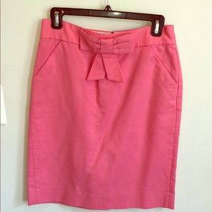 Bright pink J. Crew pencil skirt with bow